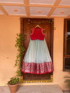 paithani lehenga set  |womens blue red Kota silk  lehenga choli |crop top lehenga set |designer paithani lehenga dupatta | wedding lehenga choli | wedding lightweight lehenga usa Women's lehenga set /Kota paithani embroidered lehenga skirt/voggish      lehengas are one of the beautiful and versatile traditional attires of india !! we carry such pieces in budget with great quality that can be styled in multiple ways with different outfits !!       Here is Beautiful ice blue Kota silk paithani border lehenga paired with contrast mix and match red pure raw silk hand embroidered high neck sleeveless crop top as shown!! This set does not comes with dupatta but can be purchased separately  !! Skirt has heavy gear and both pieces can be mix and matched with different outfits !! Ready to ship All Embroidered Lehenga, Kota Lehenga Designs, Kota Lehenga, Festival Cotton Silk Semi-stitched Choli, Red Cotton Silk Lehenga, Red Cutdana Cotton Silk Lehenga, Pink Semi-stitched Raw Silk Choli, Traditional Skirt And Top, Multi Colour Crop Top Lehenga