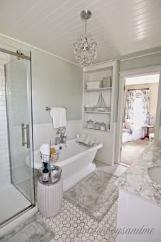 a bathroom with white fixtures and gray flooring is featured in an article about folding and sliding doors