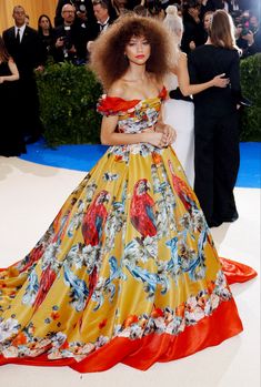 a woman in an orange and yellow dress