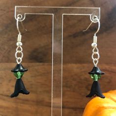 Hand beaded earrings made to look like witches, with black hats and dresses and green skin with silver plated hook. Super light weight feel Hand Beaded Earrings, Black Hats, Witch Earrings, Green Skin, Halloween Beads, Steel Lighting, Black Hat, And Dresses, Cute Earrings