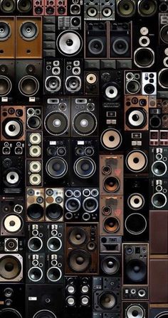 many different speakers are stacked up together