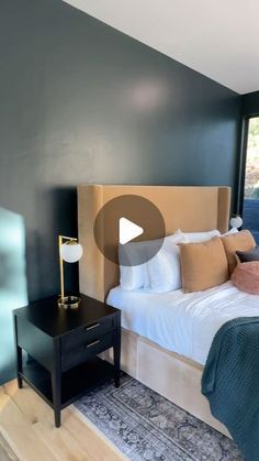 a bed room with a neatly made bed next to a window and a night stand