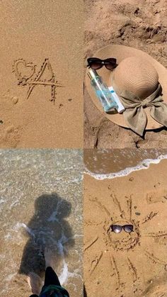 a person's feet and hat are in the sand at the beach with water