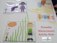 children's hand and fingerprint activity mats on a table with pictures of people