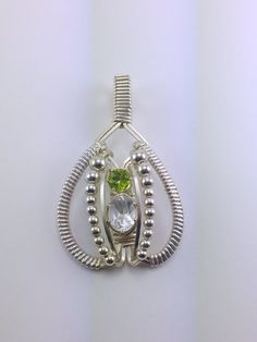 Wire Wrapped Pendant White Topaz Peridot by RyanEure on Etsy Oval Multi-stone Peridot Gemstones, Silver Peridot Oval Jewelry, Oval Peridot Silver Jewelry, Silver Oval Peridot Jewelry, Oval Peridot Multi-stone Jewelry, Williamsburg Va, Peridot Gemstone, Argentium Silver, Wire Work