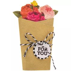 a brown paper bag with flowers in it and a tag that says for you on the front