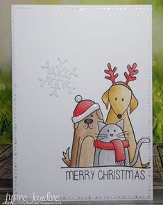 a christmas card with two dogs and a cat