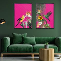 two paintings hang on the wall next to a green couch with pink and yellow flowers