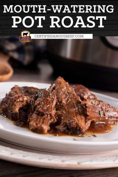 a white plate topped with meat covered in gravy next to an instant pot roast