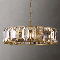 a chandelier hanging from a chain with crystal cubes on the bottom and sides