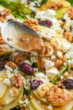 a close up of a spoon in a salad