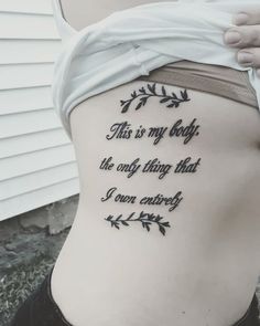 the back of a woman's stomach with an inscription that reads, this is my body