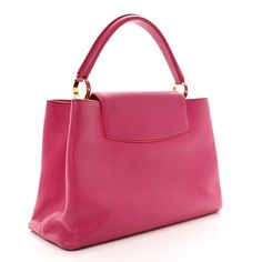 This is an authentic LOUIS VUITTON Taurillon Capucines MM in Hibiscus and Flamingo. This stylish handbag is crafted of full-grain taurillon calfskin leather. This bag features gold hardware and a leather top handle. The top is open to a coral pink leather interior with a zipper pocket. Coral Pink, Pink Leather, Leather Interior, Leather Top, Authentic Louis Vuitton, Hibiscus, Gold Hardware, Top Handle, Flamingo