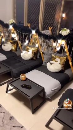 black and white couches with gold decorations on them