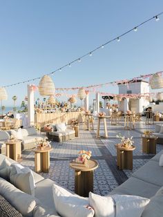 the welcome party is set up with white couches and tables