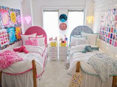 two twin beds with pink and blue comforters in a bedroom decorated for valentine's day