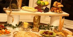 a table topped with lots of different types of food