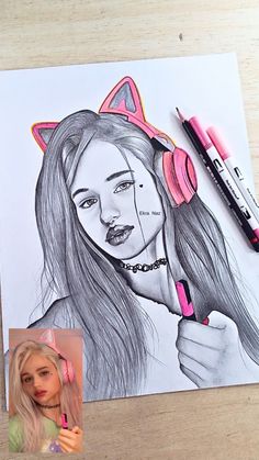 a drawing of a girl with pink headphones and cat ears on her head, next to some markers