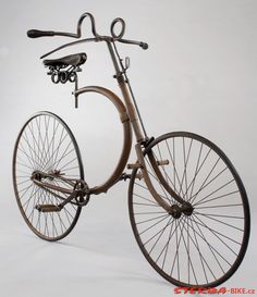 an old fashioned bicycle is shown against a white background