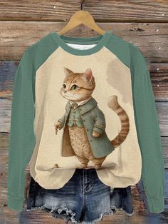 Winter Long Sleeve Tops With Cat Print, Long Sleeve Cat Print Top For Winter, Green Cartoon Print Top For Fall, Long Sleeve Tops With Cat Print For Winter, Green Cartoon Print Tops For Fall, Green Long Sleeve Cartoon Print Top, Green Long Sleeve Top With Cartoon Print, Green Cartoon Print Sweatshirt For Fall, Cat Tee Shirts