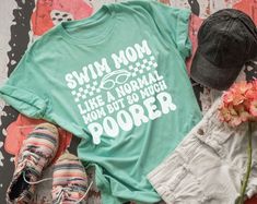 For all my swim moms.... I have another great shirt for.... Our swim mom but so much poorer shirt would be a hit with other swim moms because they can relate.... Stop by and check out other swim mom shirts we have.  This shirt comes as a screen print transfer so no adjustment can be made.  don't forget to check out our other trip shirts now available....  check out our new sweatshirts and hoodies that we are now carrying. Have questions???? Don't hesitate to inbox us.   comes on either Bella canvas or jerzees unisex shirts.  be sure to leave size and color of shirt desired in personalization box 📦   check back daily for new designs being added. Swim Mom Shirt, Swim Mom, Team Mom, Swimming Workout, Swim Team, Travel Shirts, Unisex Shirts, Mom Shirts, Swimming