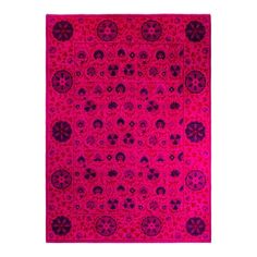 a pink and purple rug with skulls on it