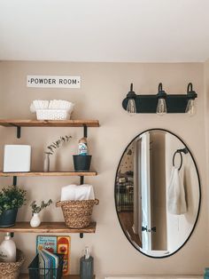 the bathroom is clean and ready to be used as a storage area for towels, books, and other items