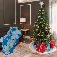 a living room with a christmas tree and presents