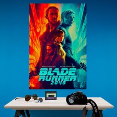 a table with a camera and some movie posters on it