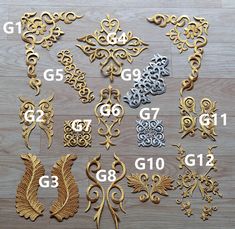 the number of decorative ornaments is shown in gold, silver and bronze colors on a wooden surface