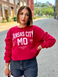 Super cozy oversized Kansas City sweatshirt Crew neckline Dropped shoulders Ribbed knit trim Mid-weight sweatshirt Oversized relaxed fit silhouette 60% Cotton, 40% Polyester Machine wash cold Elina (model) wears a small Ember wears a medium Model measurements: Height: 5’4”, Bust: 34”, Waist: 26”, Hips: 39” Color may vary due to lighting on image Trendy Oversized Red Sweatshirt, Oversized Red Sweatshirt With Ribbed Cuffs, Oversized Red Sweatshirt For Fall, Red Oversized Sweatshirt For Fall, Red Oversized Sweatshirt For Loungewear, Oversized Red Sweater With Letter Print, Red Sweats For Fall Loungewear, Red Fall Loungewear Sweats, Red Sweats With Ribbed Cuffs For Fall