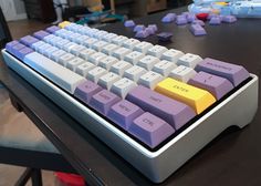 a computer keyboard sitting on top of a table