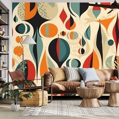 a living room with colorful wallpaper and furniture