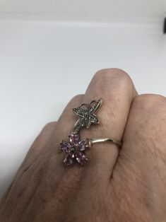 Vintage ring surrounded by Swiss cut fine Marcasite and pink ice Sterling silver Size 7 can be sized by my jeweler. His service charge is $10-$15 All rings are shipped in a nice gift box. Check out our over a THOUSAND great reviews Engraving is $4 per letter and is not always perfect depending on the piece. It can take a few days if the jeweler is busy. This is payable to Paypal Judithsltd@gmail.com Pink Sterling Silver Ring With Stone Setting, Silver Multi-stone Flower Jewelry, Silver Multi-stone Flower Rings, Silver Flower-shaped Multi-stone Rings, Pink Amethyst Ring In Sterling Silver As Gift, Silver Sterling Flower Ring With Accent Stones, Mermaid Ring, Cz Ring, Vintage Ring