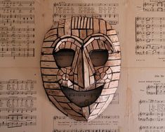 a mask made out of sheet music