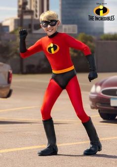 a man in a red and black costume is posing for the camera with his fist up