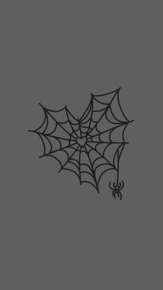 a black and white spider web on a gray background