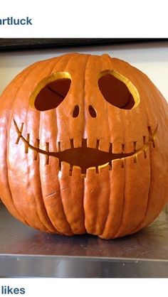 a carved pumpkin sitting on top of a table