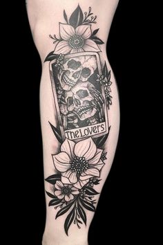 a woman's leg with a tattoo on it that says the lovers and flowers