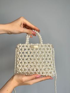 Wedding KNITKOS designer bag Bride Ivory purse mini gift beaded bridal custom personalized acrylic clutch beaded purse birthday gift This model can FITS :  - Any Phone ( except PRO MAX ) upon request, I can enlarge this bag for your IPhone without any additional fees, when placing an order in the comments, just write your IPhone model ❣️🫶🏻 - flat  - car keys ID  - driver's license  - headphones / AirPods  - cardholder  - cash lipstick  - antiseptic Dimensions - Height with handle :  (21 cm.) - Hand Beaded Bag, Bride Bag, Acrylic Clutch, Kiev Ukraine, Gifts For Fiance, Personalized Acrylic, Women's Bags By Style, Pearl Bag, Welcome Bags