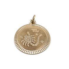 Vintage charm or pendant Style: Round disc with embossed Scorpio , Zodiac  Size: 19 mm by 19  mm tall (not including the loop/bail).   Material: 10 karat yellow gold  Weight: 1.5 grams Engraved Yellow Gold Medallion Charms, 14k Gold Medallion Engraved Charms, 14k Gold Engraved Medallion Charms, Symbolic Engraved Round Pendant Charms, Symbolic Engraved Pendant Charms, Engraved 14k Gold Medallion Charms, Engraved Yellow Gold Charms For Collectors, Vintage Yellow Gold Zodiac Sign Jewelry, Vintage Yellow Gold Zodiac Jewelry