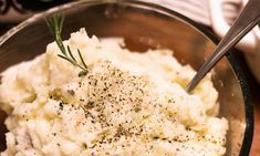 mashed potatoes with herbs and seasoning in a bowl