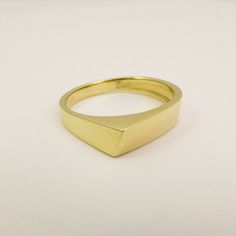 14K / 18K Solid Gold Geometric Ring for Men and Women, Wide Triangle Wedding Band Ring made of Yellow, White or Rose Gold. This ring is not symmetric in any way, the sides of the ring have different widths and it performs an interesting game of angles and geometric shapes. Wide, modern and bold design that was made to be playful and fun to wear. Strong and boldly shaped as a tiny gold sculpture, would make a great alternative wedding ring. Allowing many stacking options with other geometric desi Modern Gold Signet Promise Ring, Minimalist Yellow Gold Promise Signet Ring, Modern 14k Gold Signet Ring For Wedding, Modern Gold Couple Rings For Formal Occasions, 14k Yellow Gold Signet Promise Ring, Formal 14k Gold Stackable Rings, Formal 14k Gold Hallmarked Stackable Rings, Minimalist 14k Gold Diamond Cut Signet Ring, Minimalist 14k Gold Couple Rings For Formal Occasions