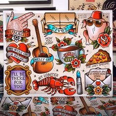 an assortment of tattoo stickers on a wooden surface with some writing and tattoos around them