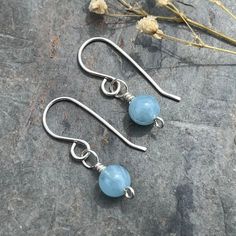 * Genuine aquamarine stones  * Little drop earrings * All parts Sterling silver  * March birthstone  Perfect for a March birthday gift but lovely for anyone who loves aquamarine  If you would like these earrings on hooks, marquis ear wires, lever backs, studs, different type of hoops please ask I have and make all types! Can be sent with a handmade, hand written gift card and will be beautifully packaged as a gift  Please see my other genuine gemstone and silver jewellery - all hand made, in my shop: RedDollyDesigns.Etsy.com Light Blue Aquamarine Birthstone Jewelry, Nickel Free Blue Aquamarine Earrings, Blue Aquamarine Nickel-free Earrings, Blue Aquamarine Earrings Nickel Free, Light Blue Aquamarine Drop Earrings, Aquamarine Earrings Gift, March Birthday Gifts, March Birthday, Aquamarine Earrings