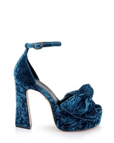 Refine your style with the Benton by Dee Ocleppo. These exquisite heels combine a plush velvet texture with a commanding platform and chic ankle strap for a secure and stylish fit. Ideal for special occasions, the dramatic color and elegant bow embellishment make these shoes a standout addition to any wardrobe. - Heel Height: 3-1/2 inches - Fit: True to size - Chic ankle strap with clasp - Velvet bow embellishment Chic Platform Heels For Events, Velvet High Heel Party Shoes, Party Velvet High Heel Shoes, Party Velvet High Heels, Velvet Heels For Party, Luxury Heels With Bow And Round Toe, Velvet Evening Heels, Velvet Heels For Evening, Elegant Velvet Party Heels