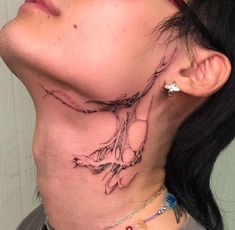 a woman with a tattoo on her neck and behind the neck is a horse head