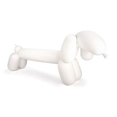 a white dog toy laying on its side