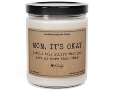 a candle that says mom, it's okay i won't tell others that you love me more than them