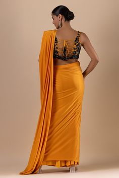 Mustard pre-draped saree. Paired with a padded blouse with crystal, cutdana, sequins and Swarovski embroidery - Aza Fashions Sleeveless Blouse With Zari Work For Evening, Fitted Sleeveless Pre-draped Saree For Festive Occasions, Fitted Sleeveless Pre-draped Saree For Festive Season, Traditional Sleeveless Blouse Piece For Evening, Traditional Sleeveless Evening Blouse Piece, Fitted Silk Pre-draped Saree, Fitted Sleeveless Pre-draped Saree For Designer Wear, Pre-draped Silk Saree With Zari Work, Designer Draped Fitted Blouse